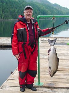 Jim Larson showing off his catch, a after fishing in Canada