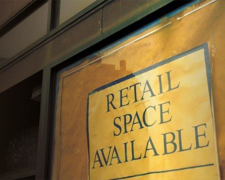 retail space avaialble sign in a window of a building