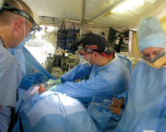 Surgeons working on a Haitian earthquake victim