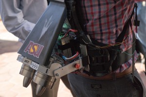The jet pack applies more than 30 pounds of thrust in a downward direction with the goal of enabling the average runner to complete a four-minute mile. Robert Gregg, a professor at the University of Texas at Dallas, wears the jet pack at the Wearable Robotics Association's WearRAcon16 in Phoenix on Feb. 10. (Photo by Travis Arbon/Cronkite News)