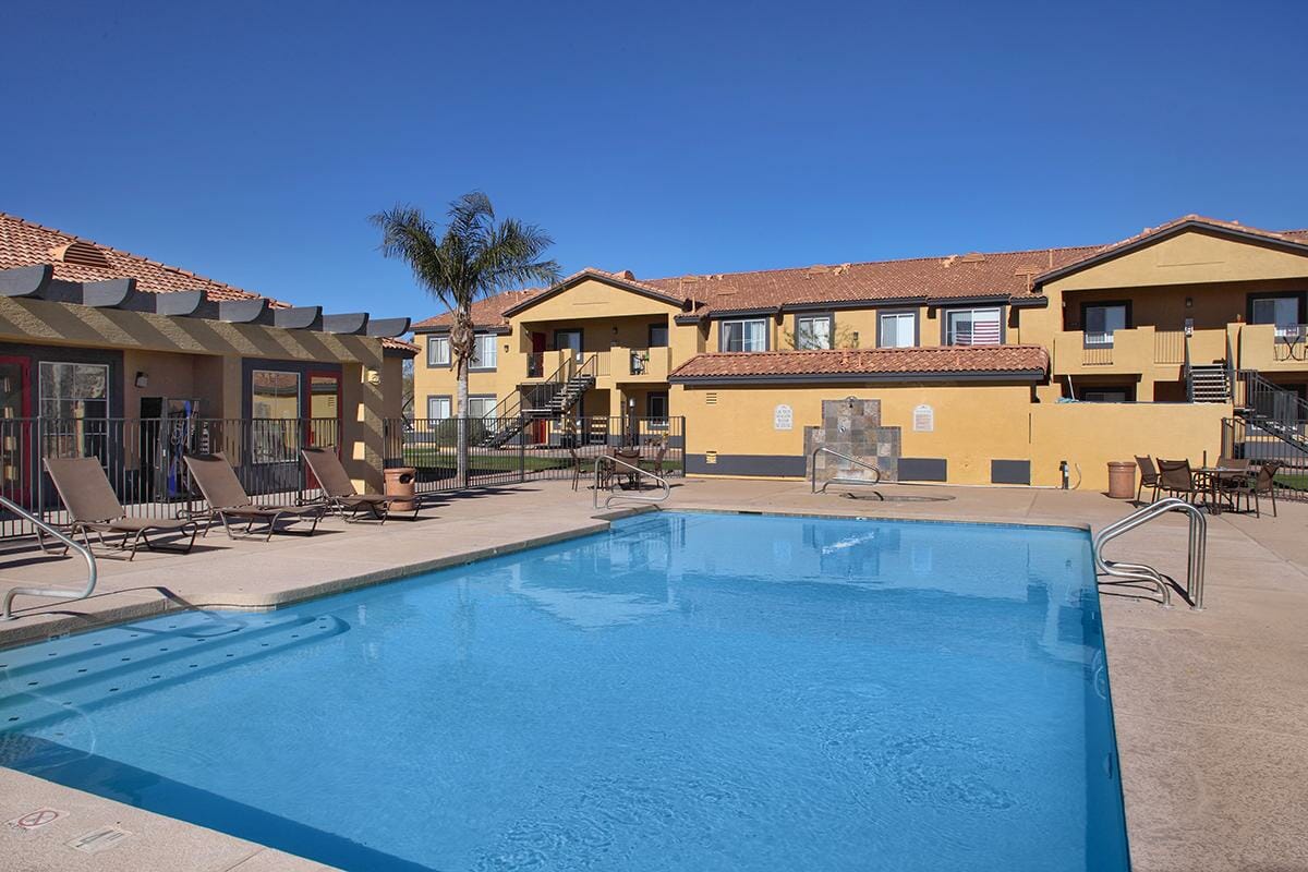 Multi-level apartment buildings with rectangular pool in Apache Junction, Arizona.