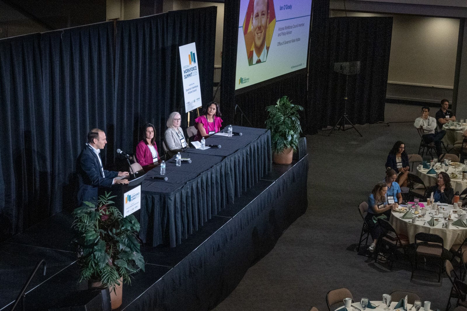 A panel moderated by Ian OGrady with speakers Jennifer Mellor, Jenna Rowell and Karla Morales (left to right) discuss workforce trends across Arizona