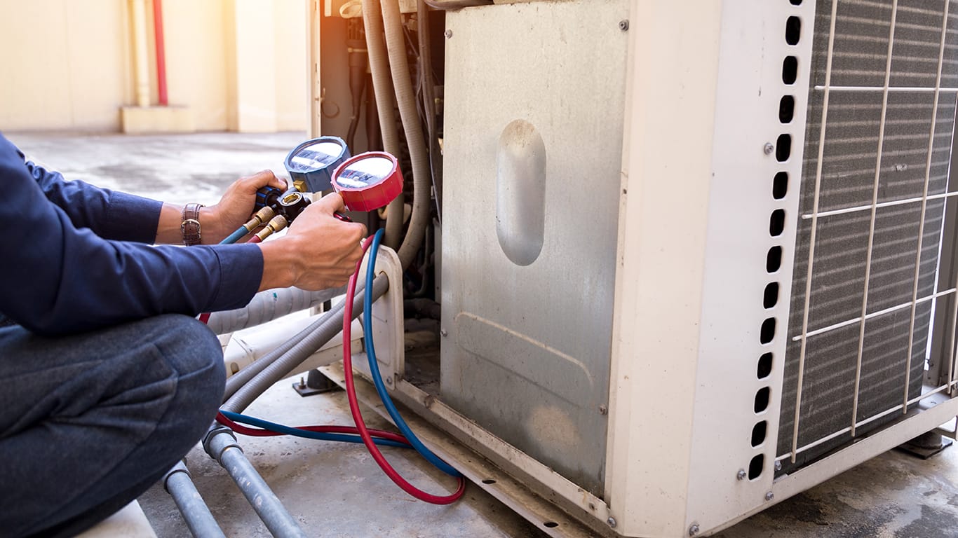 Technician is checking air conditioner ,measuring equipment for filling air conditioners.