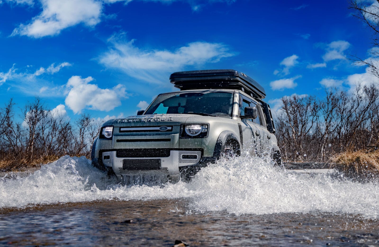 Off-roading New Land Rover Defender. The Land Rover Defender is a series of British off-road cars and pick-up trucks.