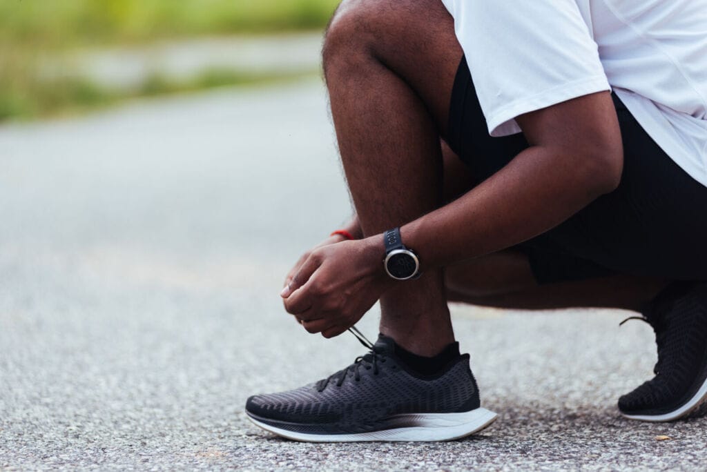 What makes black trainers ideal for daily wear 