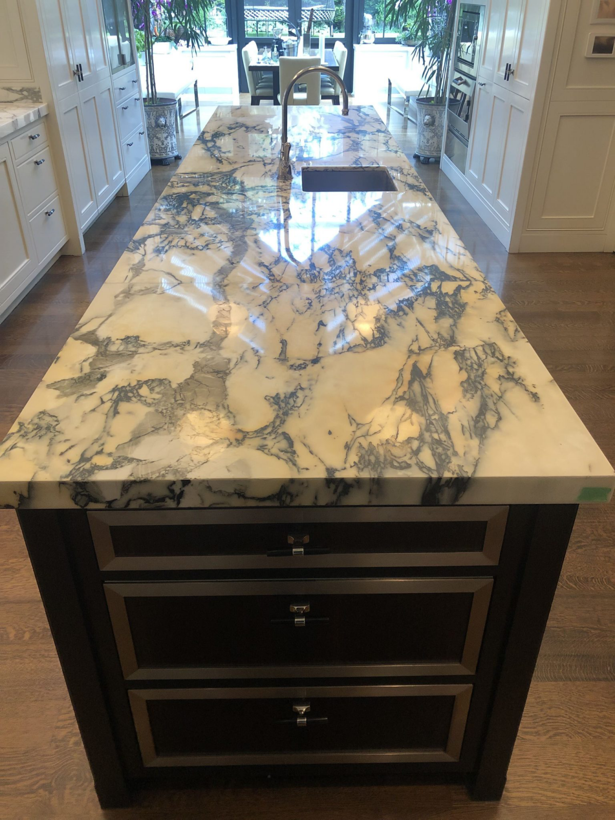Polished marble kitchen island in a Westmount, Montreal home after restoration.